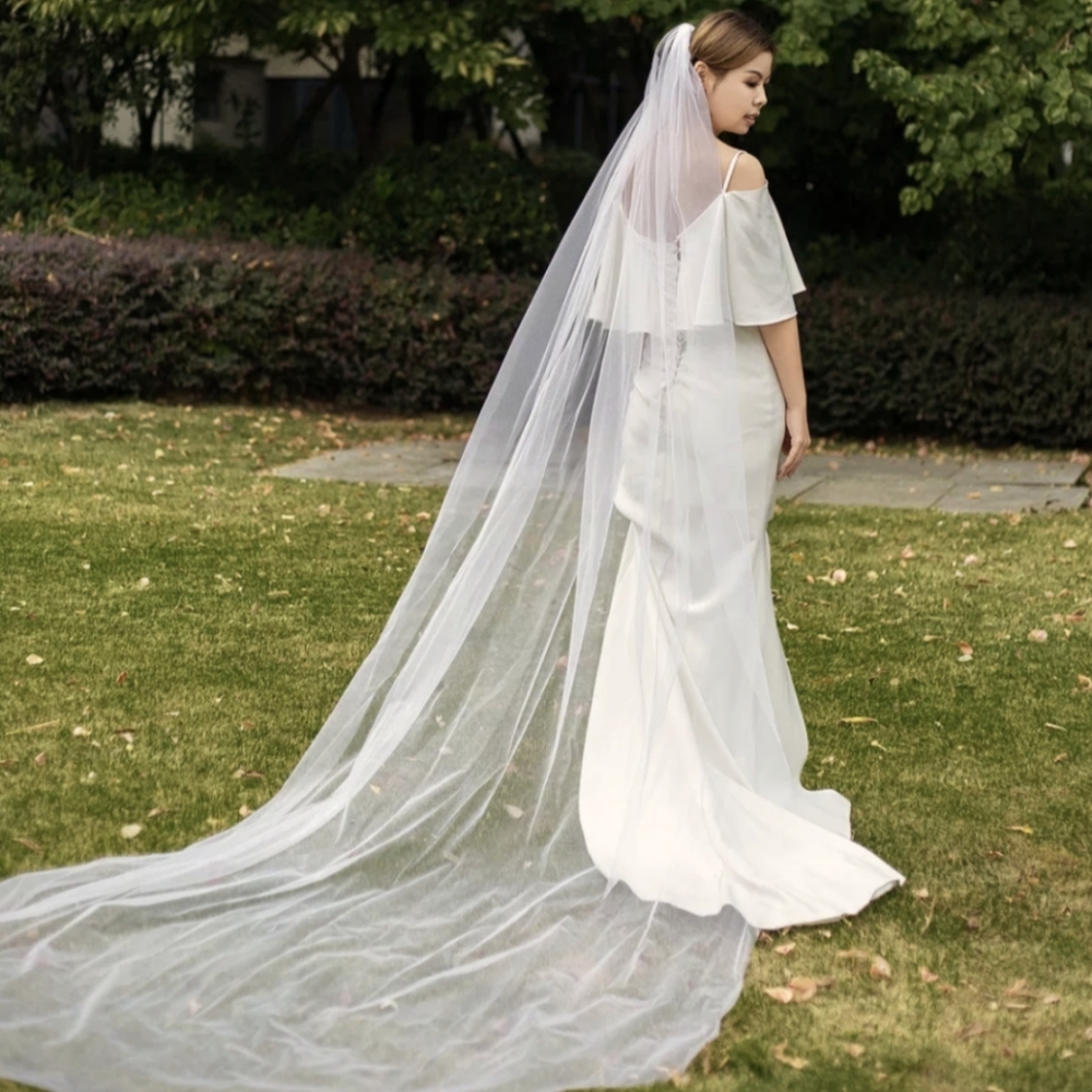 Ivory cathedral wedding and bridal veil with comb